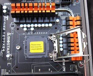 TZ77XE4-motherboard-overview-front-CPUSocket(open)-VRMHeatsinks-RamLabels.jpg